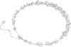 A delicate necklace with multiple clear stones arranged along a silver chain, displayed against a white background. Produktbild-Vorschau