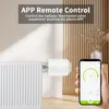 A smart radiator thermostat valve attached to a radiator, with a hand holding a smartphone displaying the app interface. Produktbild-Vorschau