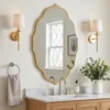 Miroir mural ovale doré avec bordure ondulée, idéal pour Voir les images du produit 1