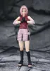 A figurine of Sakura Haruno from Naruto Shippuden, posed in a fighting stance against a rocky background. Náhled obrázku produktu