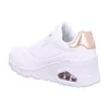 A side view of a white Skechers sneaker with rose gold accents. Voir les images du produit