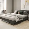 A bedroom scene with a bed, pillows, and wall decorations. Náhled obrázku produktu