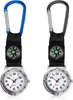 Two carabiner watches with compasses, one with a blue carabiner and the other with a black carabiner, are displayed side-by-side against a white background. Produktbild-Vorschau