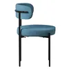 A side view of a blue upholstered chair with black metal legs. Podgląd zdjęcia produktu