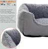 A close-up view of a grey pet bed with text and graphics on the left side. Produktbild-Vorschau