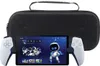 A portable gaming device with controllers attached, placed in front of a black carrying case. Anteprima dell’immagine prodotto