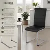 A black dining chair with a silver frame is shown next to a white table, with plants and a window in the background. Text overlays describe the chair's features. Produktbild-Vorschau