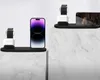 Two charging stations for electronic devices are displayed on marble pedestals against a white background. Podgląd zdjęcia produktu