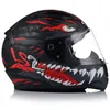 A black motorcycle helmet with a graphic design of a monster's face, including an eye and teeth, is shown against a white background. Produktbild-Vorschau