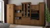 A large wooden entertainment center with multiple cabinets and shelves, displaying books and decorative items, set in a living room. Produktbild-Vorschau