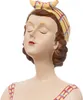 A close-up of a ceramic figurine of a woman wearing a headscarf and a red swimsuit. Anteprima dell’immagine prodotto