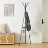 A hallway or entryway scene with a coat rack, bench, and artwork. Náhľad obrázku produktu