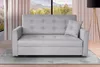 A light gray sofa is shown in a living room setting. Náhled obrázku produktu