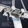 Close-up of a modern chrome shower faucet with water flowing. Podgląd zdjęcia produktu