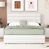 A white bed with a green blanket and pillows in a bedroom setting. Produktbild-Vorschau