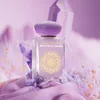 A perfume bottle is displayed with decorative crystals and fabric in a soft, purple-toned setting. Anteprima dell’immagine prodotto