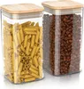 Two glass storage jars with bamboo lids, one filled with pasta and the other with coffee beans. Produktbild-Vorschau