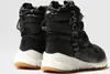 A pair of black winter boots with white soles and brown accents. Podgląd zdjęcia produktu