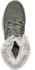 A top-down view of a green Skechers boot with white fur lining. Anteprima dell’immagine prodotto