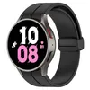 A close-up studio shot of a black smartwatch with a black strap, displaying the time and fitness metrics on its screen. Produktbild-Vorschau