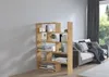 A wooden bookshelf filled with books and decorative items, placed next to a sofa in a living room. Náhled obrázku produktu