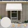 A white awning is installed over a window on a house with wooden siding. A small table and chair are set up on the patio below. Produktbild-Vorschau