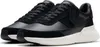 A pair of black Clarks sneakers with white soles, shown from a slightly elevated side angle against a white background. Podgląd zdjęcia produktu
