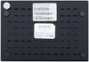 The underside of a black Android TV box with labels and ventilation slots. Produktbild-Vorschau