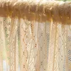 A close-up view of a cream-colored lace curtain with intricate patterns, hanging from a rod. Anteprima dell’immagine prodotto