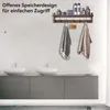 A bathroom vanity with two sinks and a wall-mounted shelf with towels and toiletries. Produktbild-Vorschau