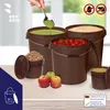 A collection of brown buckets filled with various food items, with apples in the foreground. Voir les images du produit