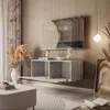 A modern living room with a wall-mounted TV cabinet and a large television. Náhled obrázku produktu