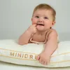 A baby is lying on a pillow. Náhled obrázku produktu