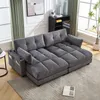A gray sectional sofa with a chaise lounge is shown in a living room setting. Anteprima dell’immagine prodotto
