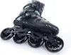 A close-up studio shot of a black and green inline skate. Podgląd zdjęcia produktu