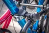 A close-up view of a bicycle rack holding two bicycles. Voir les images du produit
