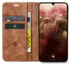 A brown leather flip case for a smartphone, with cards and a banknote inserted. Produktbild-Vorschau