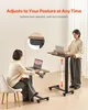 Two people using adjustable height desks in a home or office setting. Produktbild-Vorschau