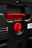 A close-up view of the red adjustment levers and height indicators on a black car seat. Produktbild-Vorschau