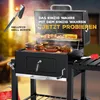 A charcoal grill with food cooking on it, with an accessory shown. Produktbild-Vorschau
