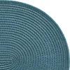 A close-up view of a teal-colored oval placemat, showing its woven texture. Produktbild-Vorschau