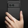 A hand holding a black phone case with a carbon fiber texture on the top and a ribbed texture on the bottom. Náhled obrázku produktu
