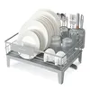 A dish drying rack filled with plates, glasses, and cutlery. Produktbild-Vorschau