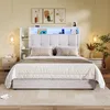 A bedroom scene featuring a bed with a headboard and integrated lighting. Produktbild-Vorschau