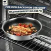 A frying pan with food inside is placed on an oven rack inside an oven. Produktbild-Vorschau