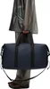 A person holding a duffel bag. Produktbild-Vorschau