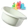 A white plastic basin is shown in the foreground, with a blurred background of various cleaning supplies. Produktbild-Vorschau