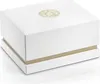 A white gift box with a gold logo on top. Produktbild-Vorschau
