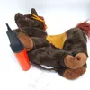 A brown inflatable horse toy with an orange hand pump next to it, lying on a white background with some instructional diagrams below. Produktbild-Vorschau