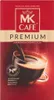 A product shot of MK Cafe Premium ground coffee packaging, featuring a steaming cup of coffee. Podgląd zdjęcia produktu